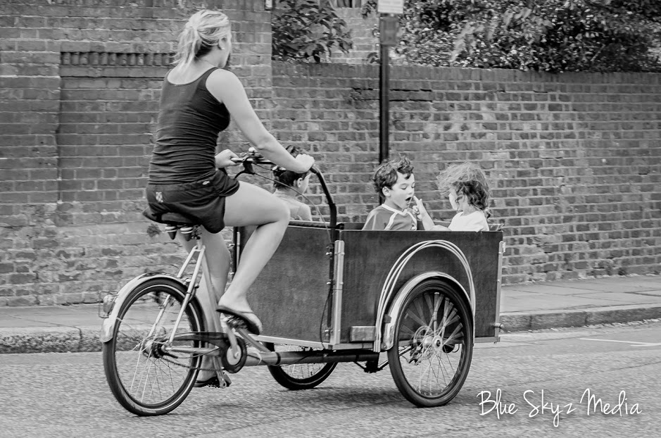 Christiania - Long, Lady in tank top and three children, b&w
